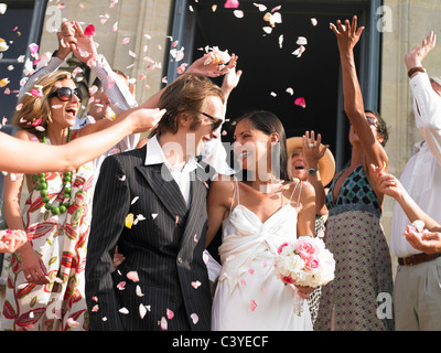 Freshly married couple leaving church Stock Photo