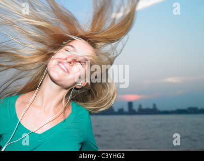 Woman listening to her mp3 player Stock Photo