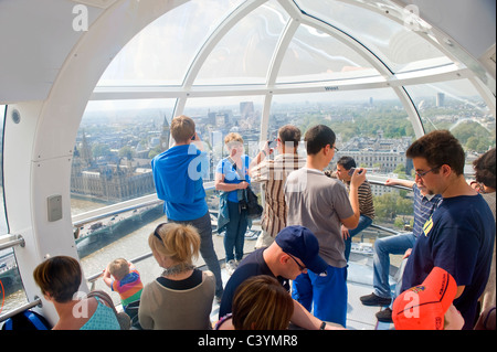 Tourists in the London eye cabin Stock Photo