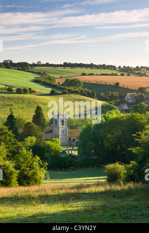 Naunton church nestled in the beautiful rolling Cotswolds countryside, Gloucestershire, England. Summer (July) 2010. Stock Photo