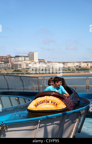 Having fun on the water rides on Brighton Pier in May Stock Photo