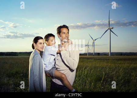 Family on a windfarm Stock Photo