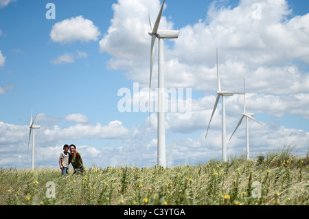 Father and son on a windfarm Stock Photo