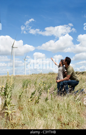 Father and son on a windfarm Stock Photo