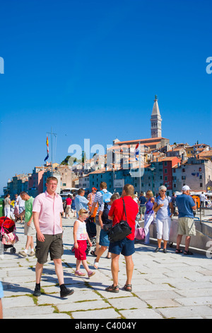Tourists on the pier of the southern harbour of Rovinj, Istria, Croatia Stock Photo