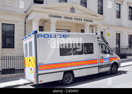 Metropolitan police force side view people carrier van parked outside Charing Cross Police Station entrance West End London England UK Stock Photo