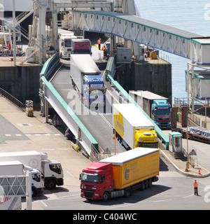 Dover Port Kent aerial view hgv lorry trucks & articulated trailers driving down ramps disembarking from cross channel ferry arriving in England UK Stock Photo