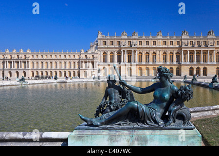 Bronze statues in garden of Versailles. The famous palace of the Sun King: Louis XIV. Stock Photo