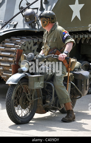 American Military Police on motorbike and Second World War M4 Sherman battle tank during parade at Leopoldsburg, Belgium Stock Photo