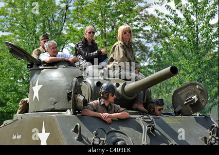 Second World War collectors on M4 Sherman battle tank during parade at the open day of the Belgian army at Leopoldsburg, Belgium Stock Photo