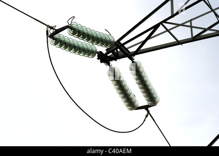 Closeup of insulators on a high voltage electric pillar Stock Photo