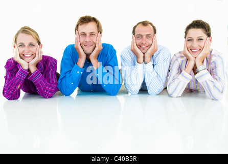 Business team laying on floor Stock Photo