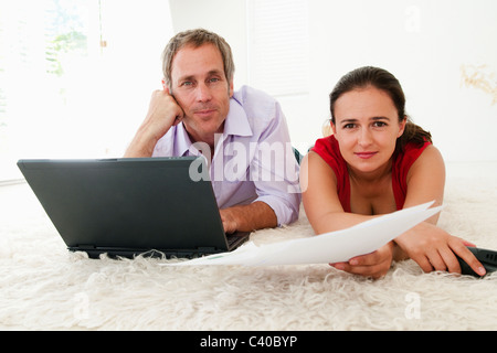 Portrait of couple paying bills