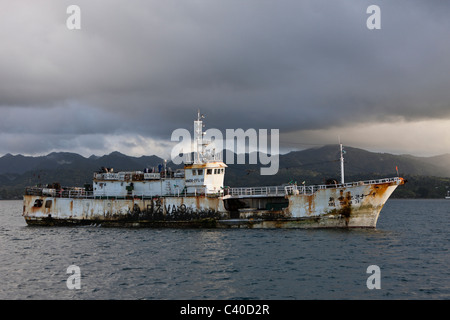 Cargo Boats laying at anchor, Beqa Lagoon, Viti Levu, Fiji Stock Photo