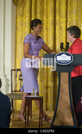 First lady Michelle Obama greets Secretary of Homeland Security Janet A. Napolitano in the East Room of the White House. She and Stock Photo