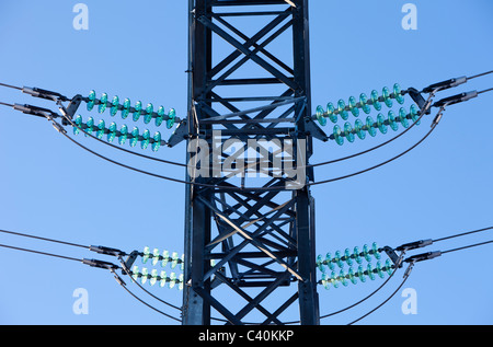Green glass insulators in a high-voltage power line , Finland Stock Photo