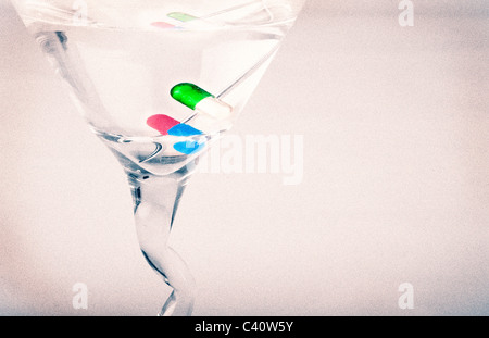 Martini with pill capsules for a garnish. Stock Photo