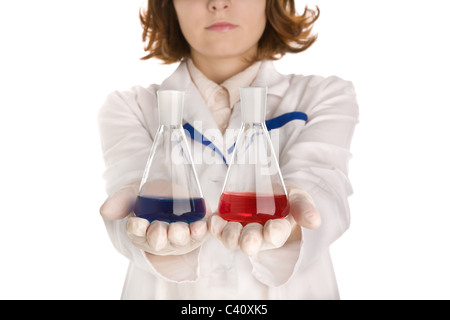 Chemist with two flasks with different samples of liquid Stock Photo