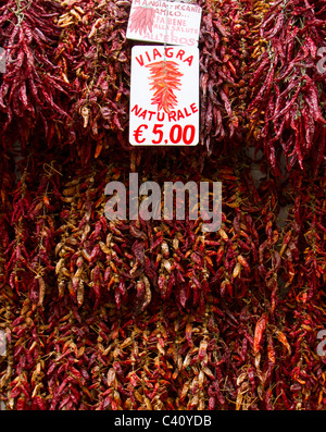 Dried chilli peppers for sale in Amalfi, advertised as a natural aphrodisiac Stock Photo