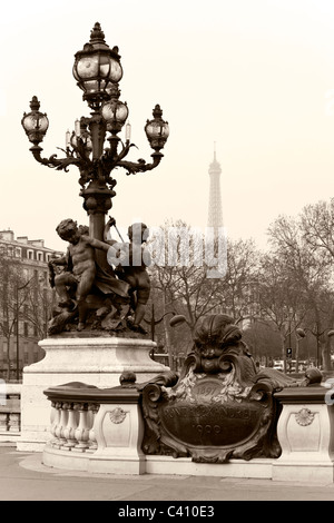 Street lantern on the Alexander III Bridge against the Eiffel Tower in Paris, France. Stock Photo