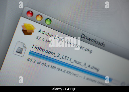 close up of a computer screen showing items downloading Stock Photo