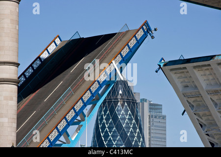 Close-up of grade 1 listed Tower bridge open with the Gherkin in background London England Europe Stock Photo