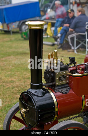 Closeup view of the front of miniature steam driven traction engine on display at a steam fair. Stock Photo