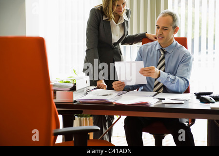 Businessman talking to colleague Stock Photo
