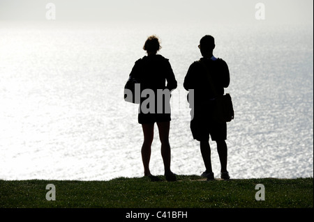 Couple at Etretat cliff,Normandy,France Stock Photo