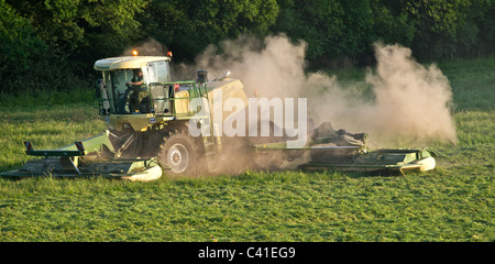 A Krone Big M 500 massive grass cutting machine working in drought conditions in the South of England.