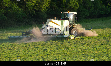 A Krone Big M 500 massive grass cutting machine working in drought conditions in the South of England.