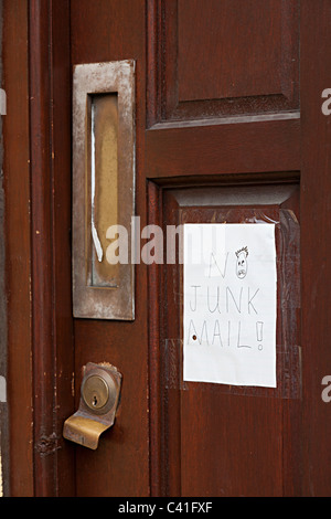 Handwritten No Junk Mail sign on door Cardiff Wales UK Stock Photo