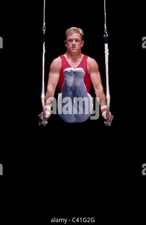 Male gymnast on the rings Stock Photo - Alamy
