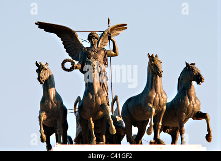 Bronze statue of goddess Victory riding quadriga- detail on the roof of the monument of Victor Emmanuel II in Rome, Italy Stock Photo