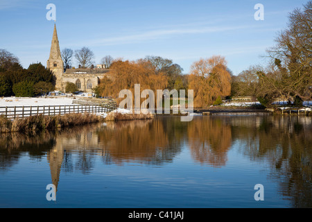 All Saint's church and Brompton ponds at Brompton by Sawdon, North Yorkshire. Stock Photo