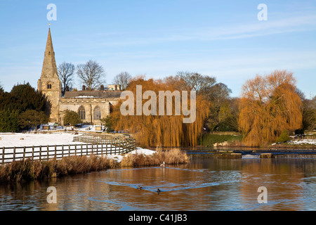 All Saints church and Brompton ponds at Brompton by Sawdon, North Yorkshire. Stock Photo