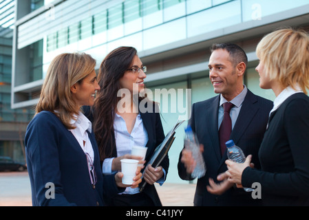 Colleagues taking coffee break outdoors Stock Photo