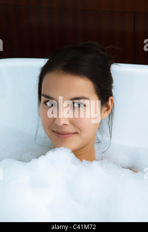 Woman relaxing in bubble bath, portrait Stock Photo