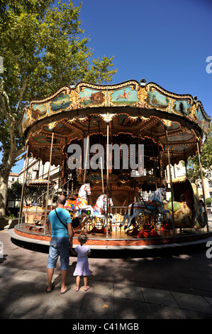 France, Provence, Avignon, place de l'horloge, merry-go-round Stock Photo