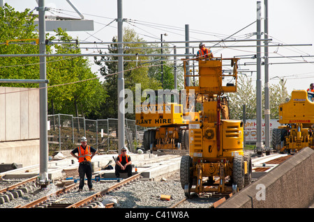 Manchester Metrolink tram route under construction near the future Etihad Campus stop, Eastlands, Manchester, England, UK Stock Photo