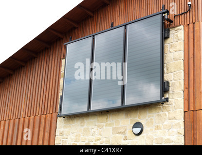 solar panels on side of new building Stock Photo