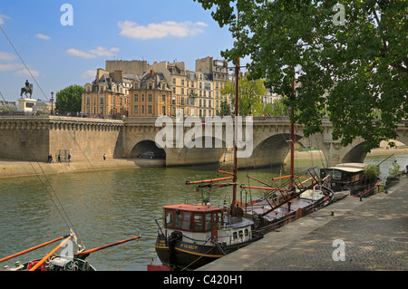 Seine barges tied up on the Left Bank near Pont Neuf and Ile de la Cite, Paris. Stock Photo