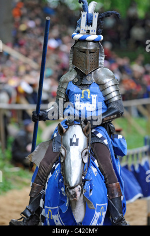 performer of the medieval festival, dressed in historical costume as knight on horse in Oettingen, Bavaria, Germany Stock Photo