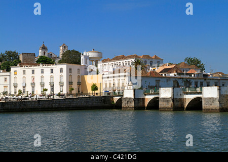 Tavira waterfront with the Ponte Romana and the hilltop churches and castle remains, Algarve, Portugal. Stock Photo