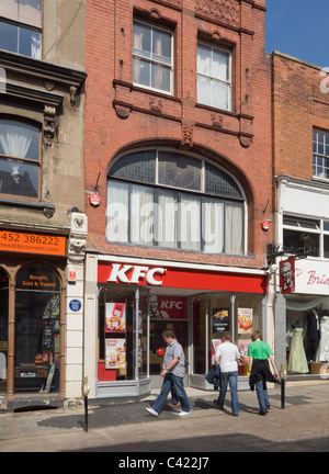 Branch of the KFC fast food chain, formerly Kentucky Fried Chicken, in Westgate Street, Gloucester Stock Photo