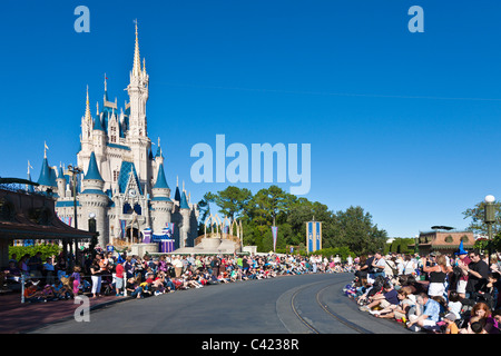 Park guests line the street waiting for A Dream Come True parade at the Magic Kingdom in Disney World, Kissimmee, Florida Stock Photo