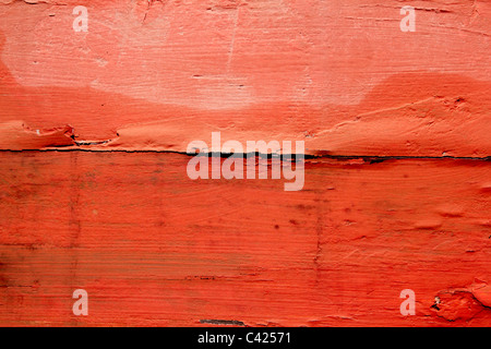 aged weathered wood painted in red orange color background texture Stock Photo