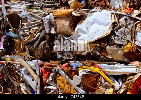 iron scrap metal compacted to recycle green process ecology industry Stock Photo