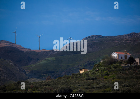 Windmills in a mountain windfarm in Chania prefecture, Crete, Greece. Stock Photo
