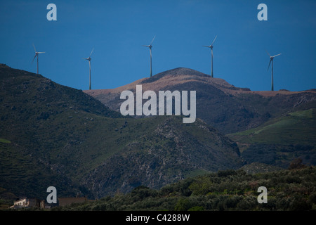 Windmills in a mountain windfarm in Chania prefecture, Crete, Greece. Stock Photo